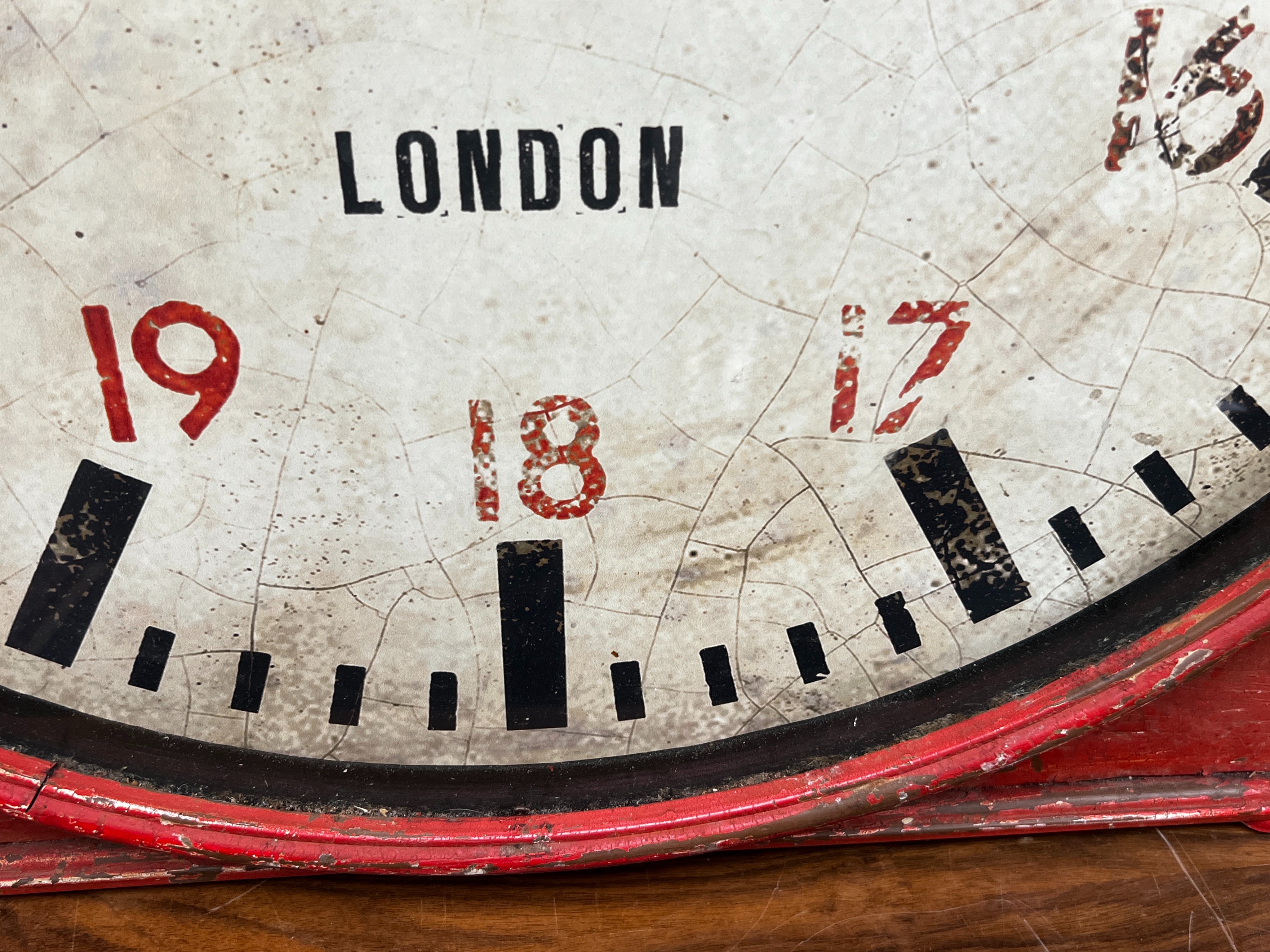 An industrial style painted metal clock console table modelled as a set of scales, width 102cm, depth 46cm, height 80cm.